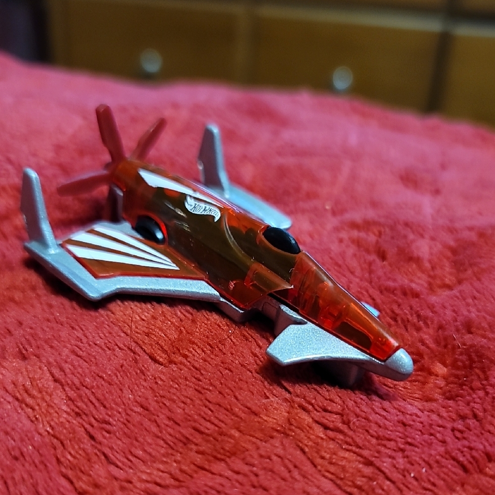 Red and Silver Toy Jet